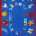 A blue educational kids rug with the Hebrew alphabet and animals around the edge.