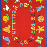 A red educational kids rug with the Hebrew alphabet and animals around the edge.