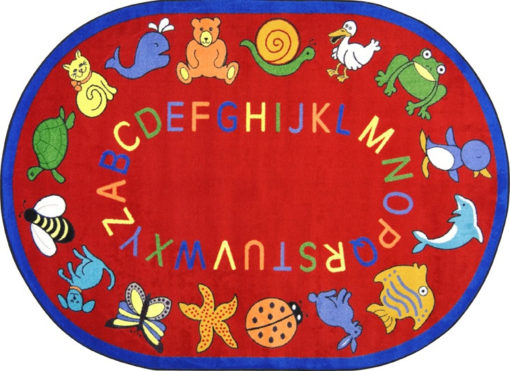 A red oval kids rug with animals and alphabet around the edge.