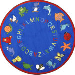 A round blue kids rug with animals and the alphabet around the edge