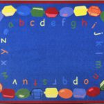 A blue baby rug with beads and alphabet in lower case around the edge.