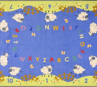 An alphabet rug with numbers and several lamb.