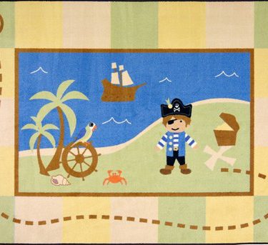 A baby rug with a whimsical pirate, ship and bird.