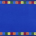 A blue child rug with alphabet in upper and lower case around the edge