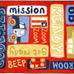 A red kids rug with words and cars.