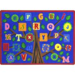 An educational kids rug with a tree and alphabet leaves.