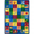 An educational kids rug with numbers, shapes and alphabet in upper and lower case.