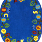 A blue oval educational kids rug with the alphabet in upper case on leaves of a tree.