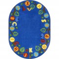 A blue oval educational kids rug with the alphabet in upper case on leaves of a tree.