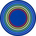 A round kids rug with rainbow colored rings around the rug.