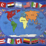An educational kids rug with the map of the world and flags of countries around the edge