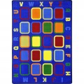 An educational rug with multi-colored squares and alphabet around the edge.
